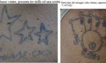 Cadavere abbandonato nei boschi: la questura diffonde le immagini dei tatuaggi